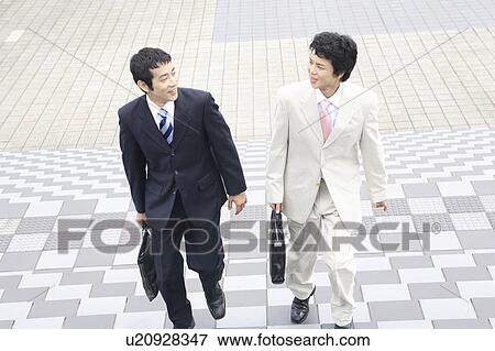 Stock Photo - Businessmen moving. Fotosearch