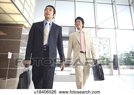 Stock Photograph - Businessmen moving. Fotosearch