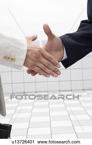Businessmen shaking hands View Large Photo Image Stock Image - Businessmen shaking hands. Fotosearch