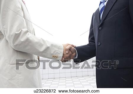 Businessmen shaking hands View Large Photo Image Stock Image - Businessmen shaking hands. Fotosearch