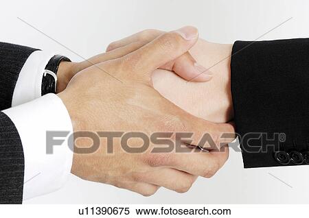 Hand of a businessman shaking hands View Large Photo Image Stock Photography - Hand of a businessman shaking hands. Fotosearch