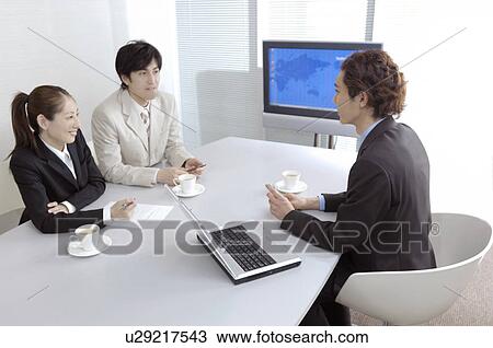 Office workers during conference View Large Photo Image Stock Image - Office workers during conference. Fotosearch