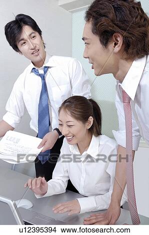 Picture - Office workers who do a meeting. Fotosearch