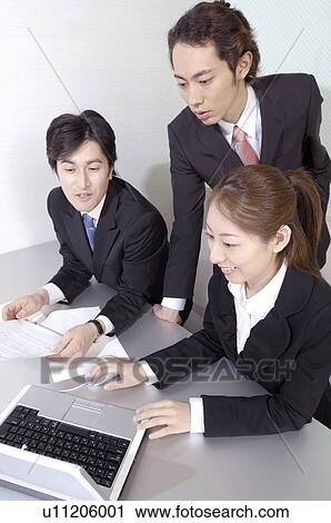 Office workers who do a meeting View Large Photo Image Stock Image - Office workers who do a meeting. Fotosearch