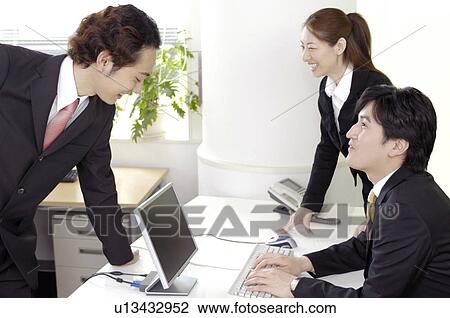 Office workers who do a meeting View Large Photo Image Stock Image - Office workers who do a meeting. Fotosearch
