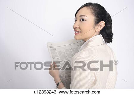 Business lady reading a newspaper View Large Photo Image Stock Image - Business lady reading a newspaper. Fotosearch