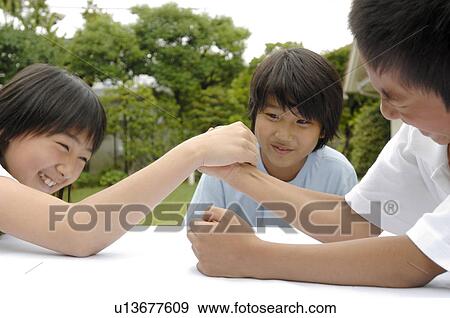 Arm wrestling View Large Photo Image Stock Photo - Arm wrestling. Fotosearch