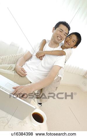 Stock Photo - Child who clings to the father. Fotosearch