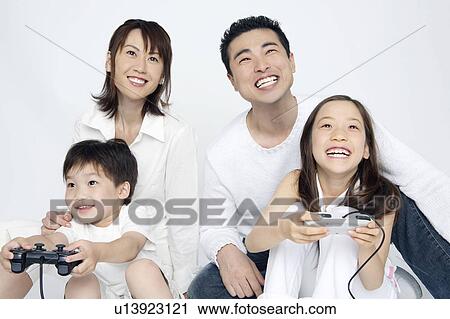 Children playing the game with parents View Large Photo Image Stock Image - Children playing the game with parents. Fotosearch