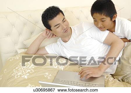 Stock Photo - Father and son. Fotosearch