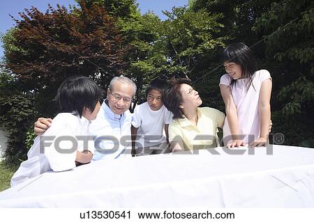 Ggrandchild and grandparents relaxing outside View Large Photo Image Stock Image - Ggrandchild and grandparents relaxing outside. Fotosearch