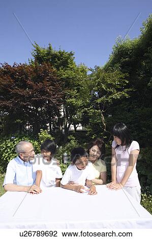 Ggrandchild and grandparents relaxing outside View Large Photo Image Stock Image - Ggrandchild and grandparents relaxing outside. Fotosearch