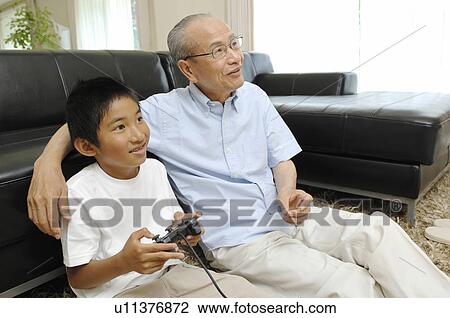 Stock Image - Grandad and grandchild. Fotosearch