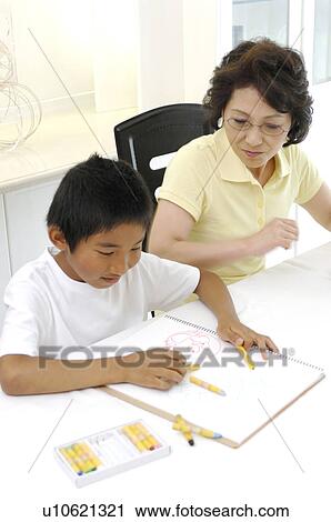 Stock Image - Grandma who sees drawing. Fotosearch
