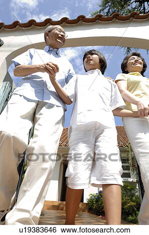 Stock Photograph - Husband and wife and grandchild. Fotosearch