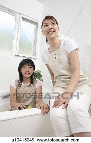 Stock Photo - Parent and child in the bath. Fotosearch