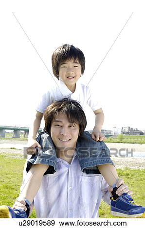 Stock Photo - Parent and child who does a pickaback. Fotosearch