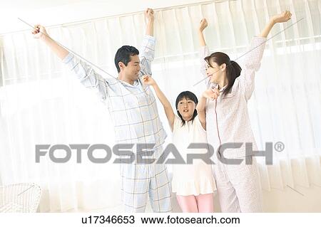 Stock Image - Parent and child who stretch themselves. Fotosearch