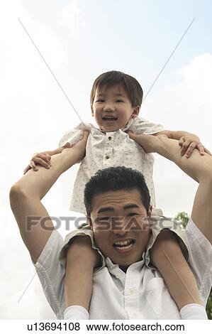 Pickaback of the father View Large Photo Image Stock Photo - Pickaback of the father. Fotosearch