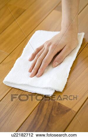 Stock Image - Hand cleaning a floor. Fotosearch