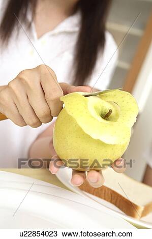 Hand peeling the apple View Large Photo Image Stock Image - Hand peeling the apple. Fotosearch