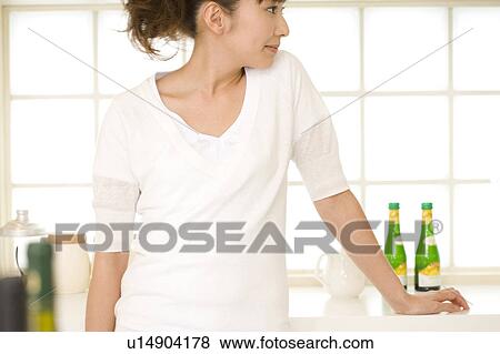 Scene of woman cooking View Large Photo Image Stock Photo - Scene of woman cooking. Fotosearch
