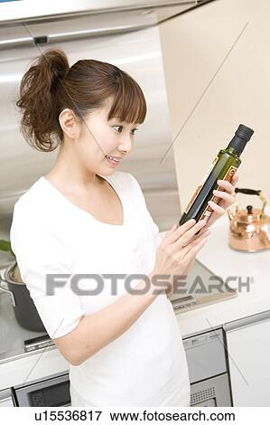 Scene of woman cooking View Large Photo Image Stock Photo - Scene of woman cooking. Fotosearch