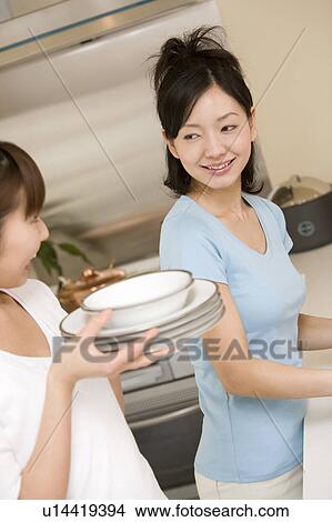 Scene of women cooking View Large Photo Image Picture - Scene of women cooking. Fotosearch