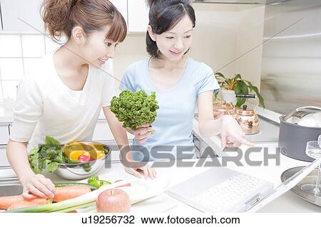 Scene of women cooking View Large Photo Image Stock Image - Scene of women cooking. Fotosearch