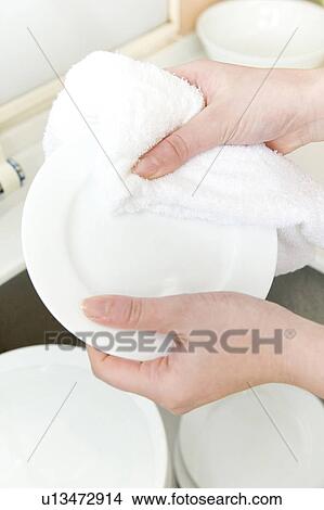 Wipe a plate View Large Photo Image Picture - Wipe a plate. Fotosearch