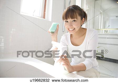 Woman cleaning bathroom View Large Photo Image Stock Image - Woman cleaning bathroom. Fotosearch