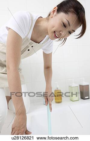 Woman doing bathroom cleaning View Large Photo Image Stock Image - Woman doing bathroom cleaning. Fotosearch