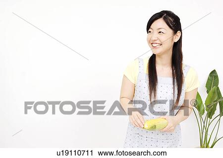Stock Image - Woman having corn. Fotosearch