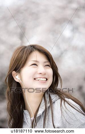 Stock Image - Cherry tree and woman. Fotosearch