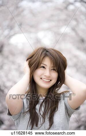 Stock Photography - Cherry tree and woman. Fotosearch