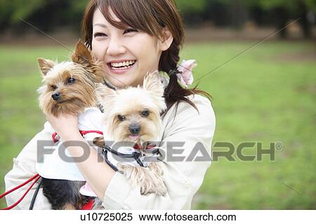 Stock Photography - Woman and dogs. Fotosearch