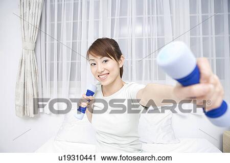 Woman who has gymnastic exercise at night View Large Photo Image Stock Image - Woman who has gymnastic exercise at night. Fotosearch
