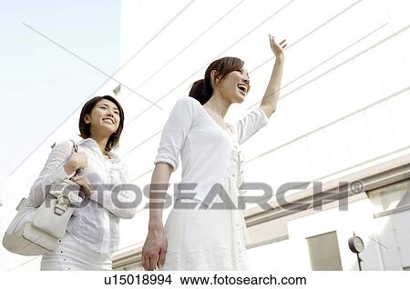Picture - Women who waits for the taxi. Fotosearch