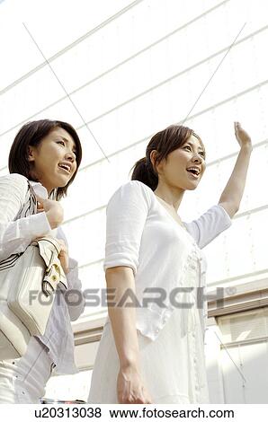 Stock Photo - Women who waits for the taxi. Fotosearch