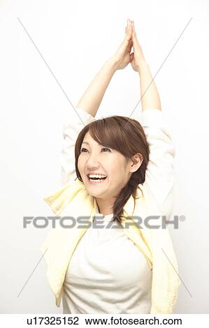 Stock Image - Wwoman stretching herself. Fotosearch