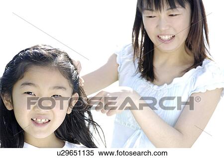 Stock Photography - Braiding girl. Fotosearch
