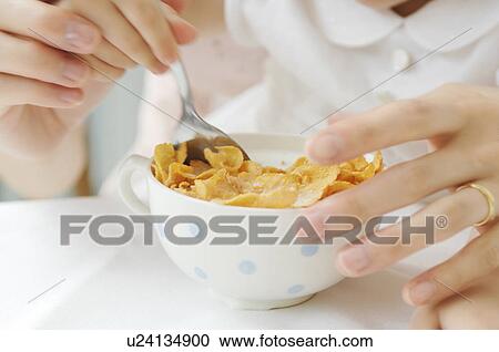 Infant who eats a corn flake View Large Photo Image Stock Image - Infant who eats a corn flake. Fotosearch