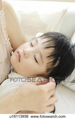 Infant who goes to bed with the maulstick View Large Photo Image Stock Photograph - Infant who goes to bed with the maulstick. Fotosearch