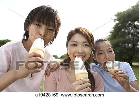 Parent and child who eats ice cream View Large Photo Image Stock Photo - Parent and child who eats ice cream. Fotosearch