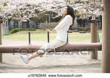 Stock Photo - Cherry tree and woman. Fotosearch