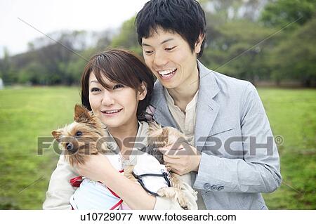 Couple and dogs View Large Photo Image Stock Photo - Couple and dogs. Fotosearch