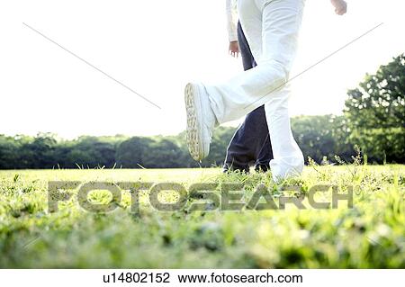 Stock Image - Couple at the park. Fotosearch