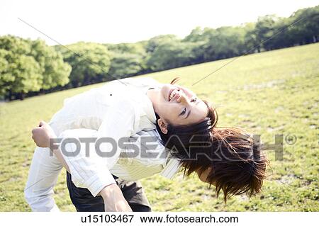 Stock Photo - Couple at the park. Fotosearch