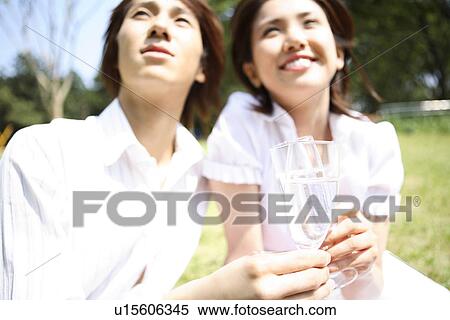 Couple who has a glass View Large Photo Image Stock Photography - Couple who has a glass. Fotosearch