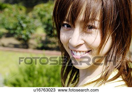 Stock Image - Smiling woman. Fotosearch